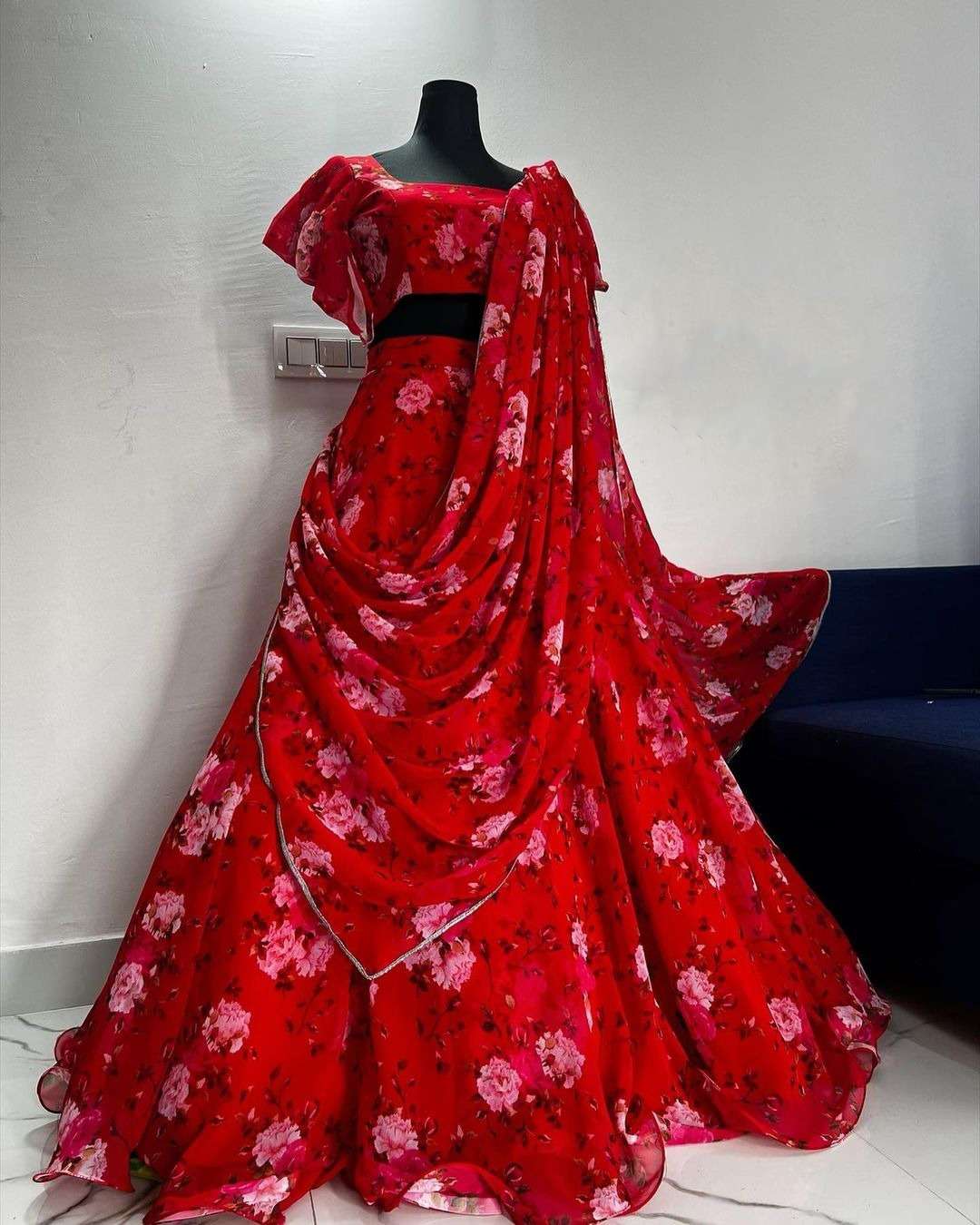 lehenga choli made with georgette print in sky blue and red colour this masterpiece speaks elegance