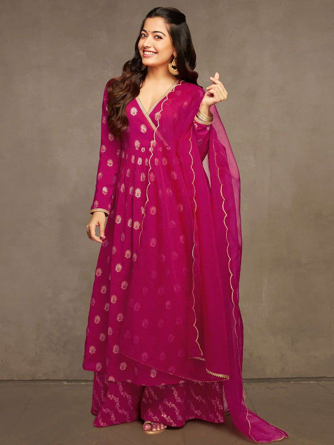 rashmika pink suit this beautiful angrkha neck line suit is a perfect fit for diwali season getting you the most glamorous look golden thread readymade pink suit bollywood concept  