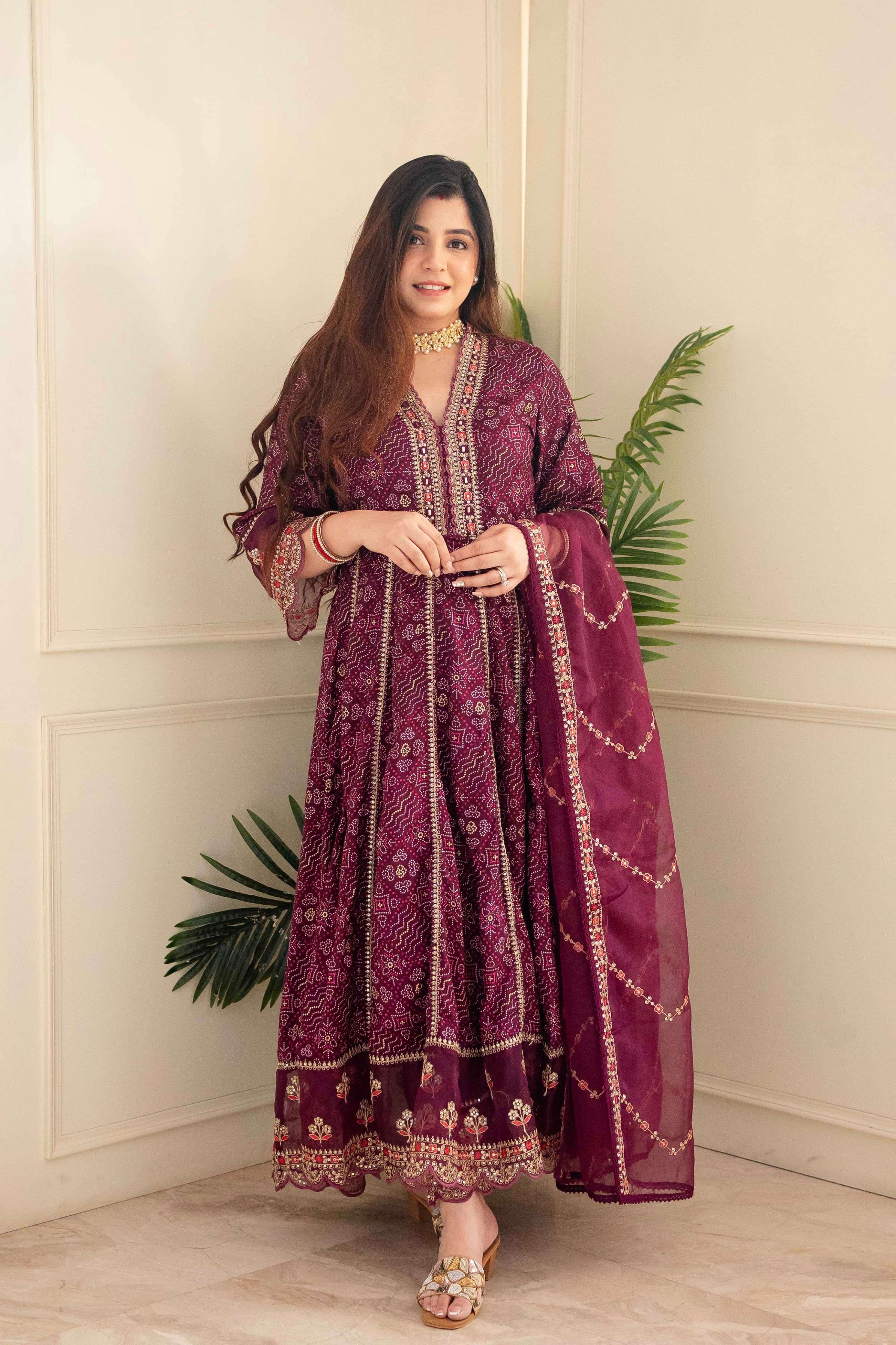 meera red voluminous anarkali suit set beautiful heavy suit set which is beautifully decorated with intricate hand embroidery zari weaving and prints 