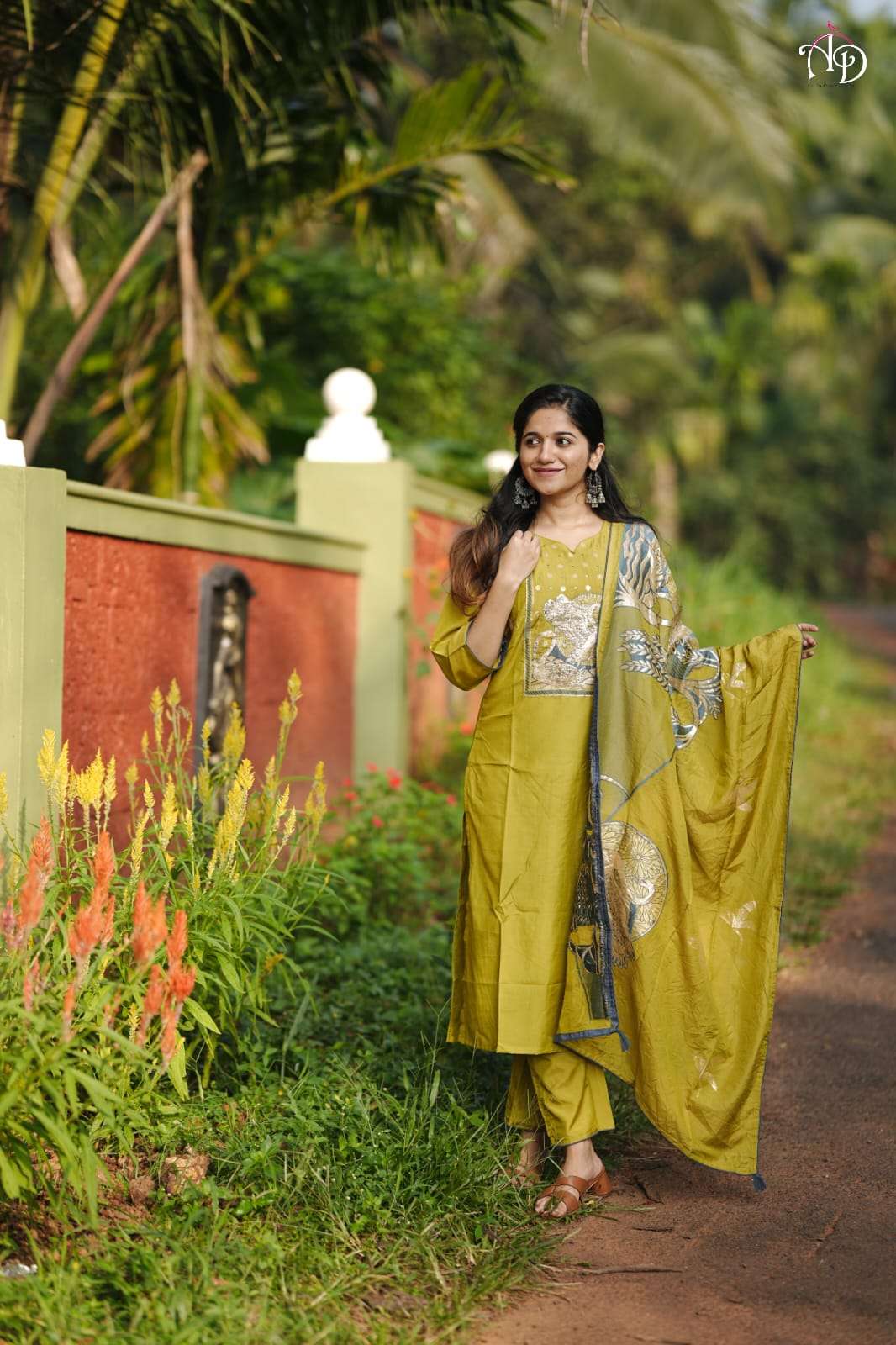 stunning olive green kurtie set featuring intricate golden thread work design on the front paired with a matching dupatta showcasing a subtle yet elegant handwork suit 